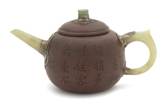 A Porcelain Teapot having a red