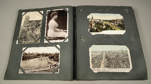 A postcard album containing over