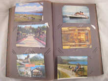 A postcard album with a quantity of