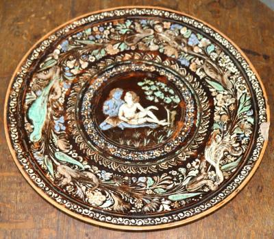 A pottery charger decorated in