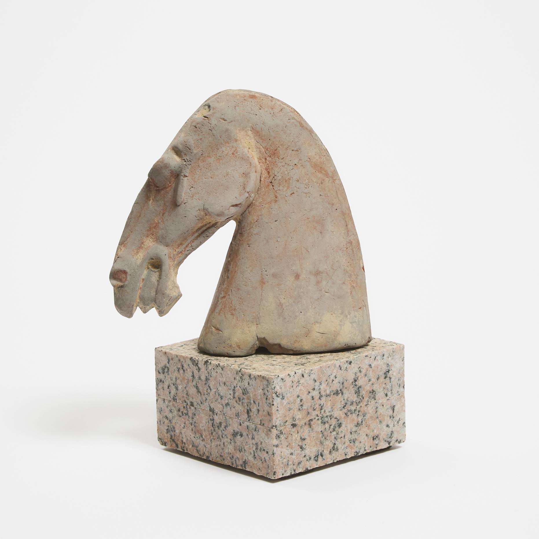 A Pottery Horse Head on a Marble