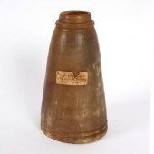 A powder horn with label 'Brou