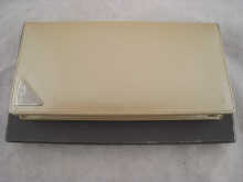 A Prada purse in original box.