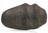 A PREHISTORIC 3/4 GROOVE STONE