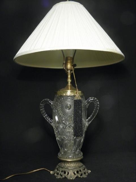 A pressed glass trophy vase mounted