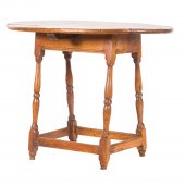 A PRIMITIVE OVAL TAP TABLE A P
