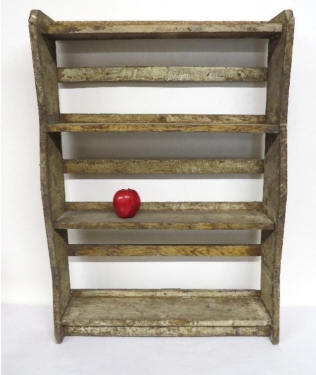 A PRIMITIVE WALL SHELF IN GRAY