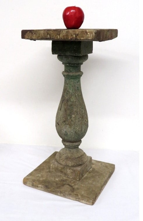 A PRIMITIVE WOODEN PEDESTAL IN