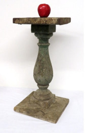 A PRIMITIVE WOODEN PEDESTAL IN