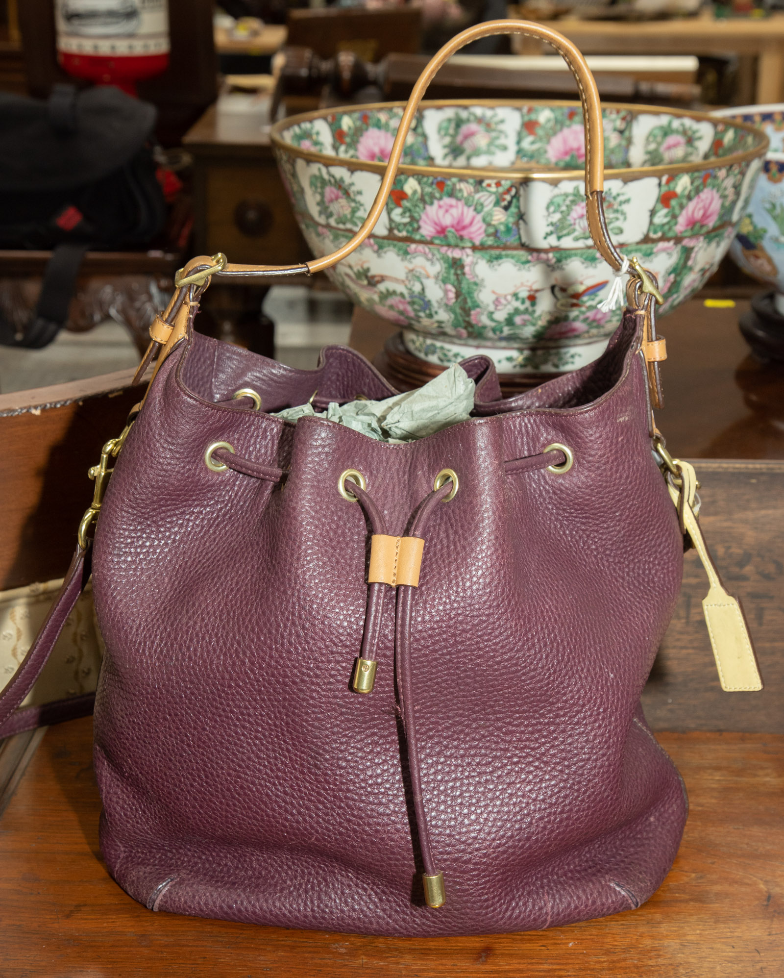 A PURPLE COACH BUCKET BAG A purple,