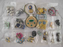 A quantity of buttons including a
