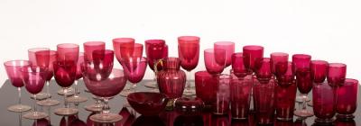 A quantity of cranberry glass