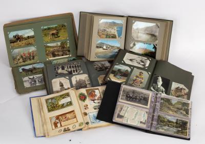 A quantity of postcards contained