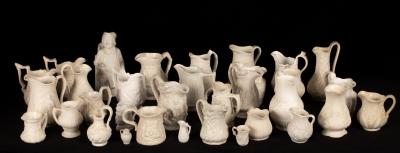 A quantity of saltware jugs,