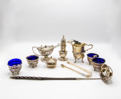 A quantity of silver cruets,