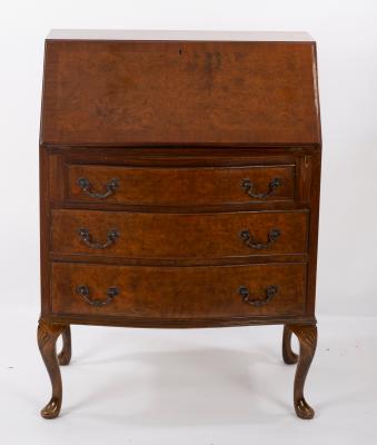 A Queen Anne style walnut bureau on