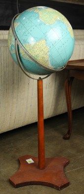 A RAND MCNALLY GLOBE ON STAND