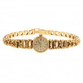A RARE 18K OMEGA 1960S WATCH B