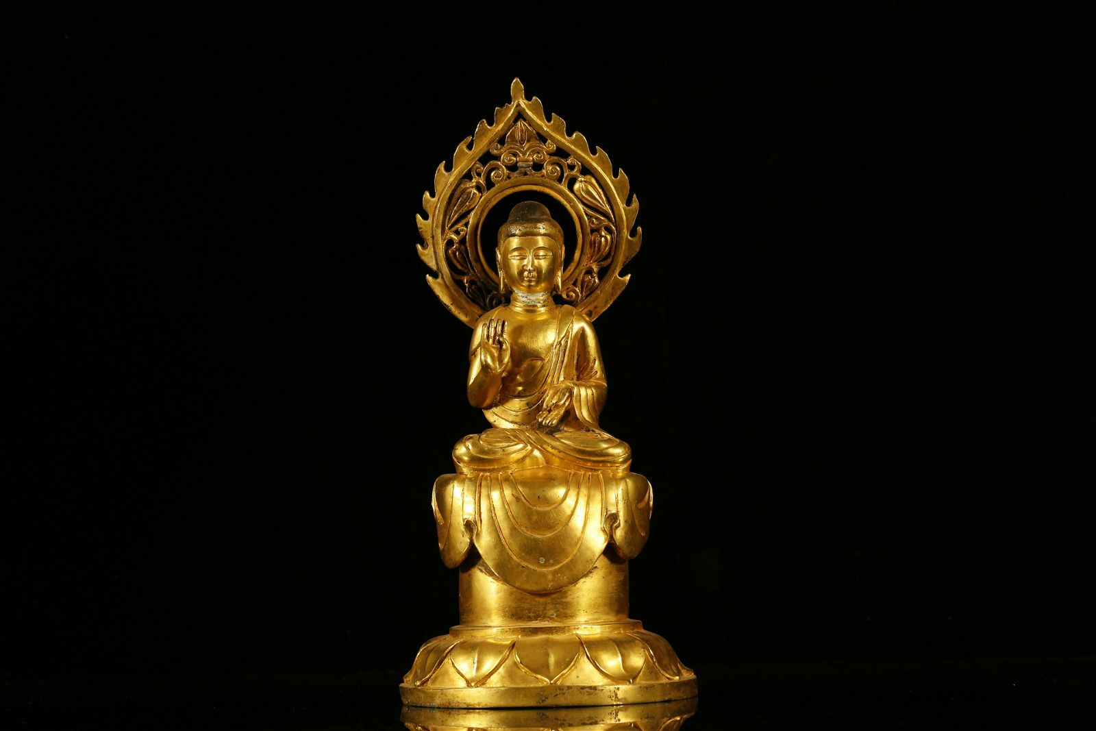 A RARE GILT-BRONZE FIGURE OF
