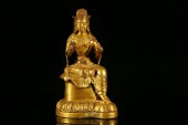 A RARE GILT-BRONZE FIGURE OF G