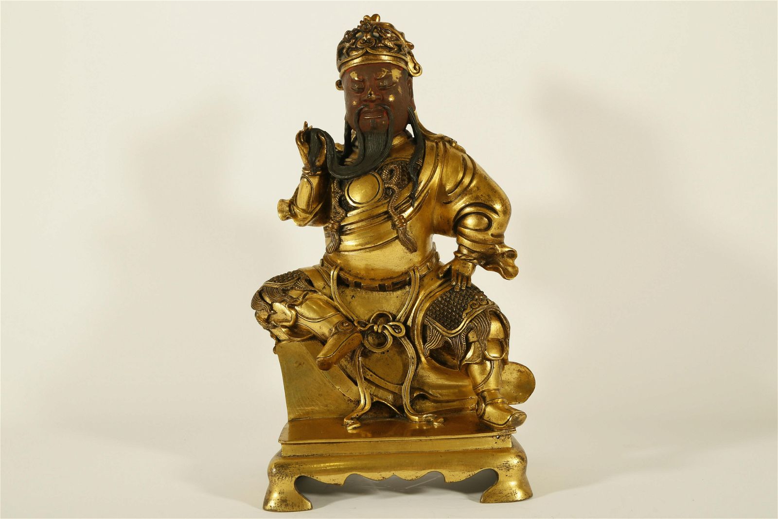 A RARE GILT-BRONZE FIGURE OF GUAN