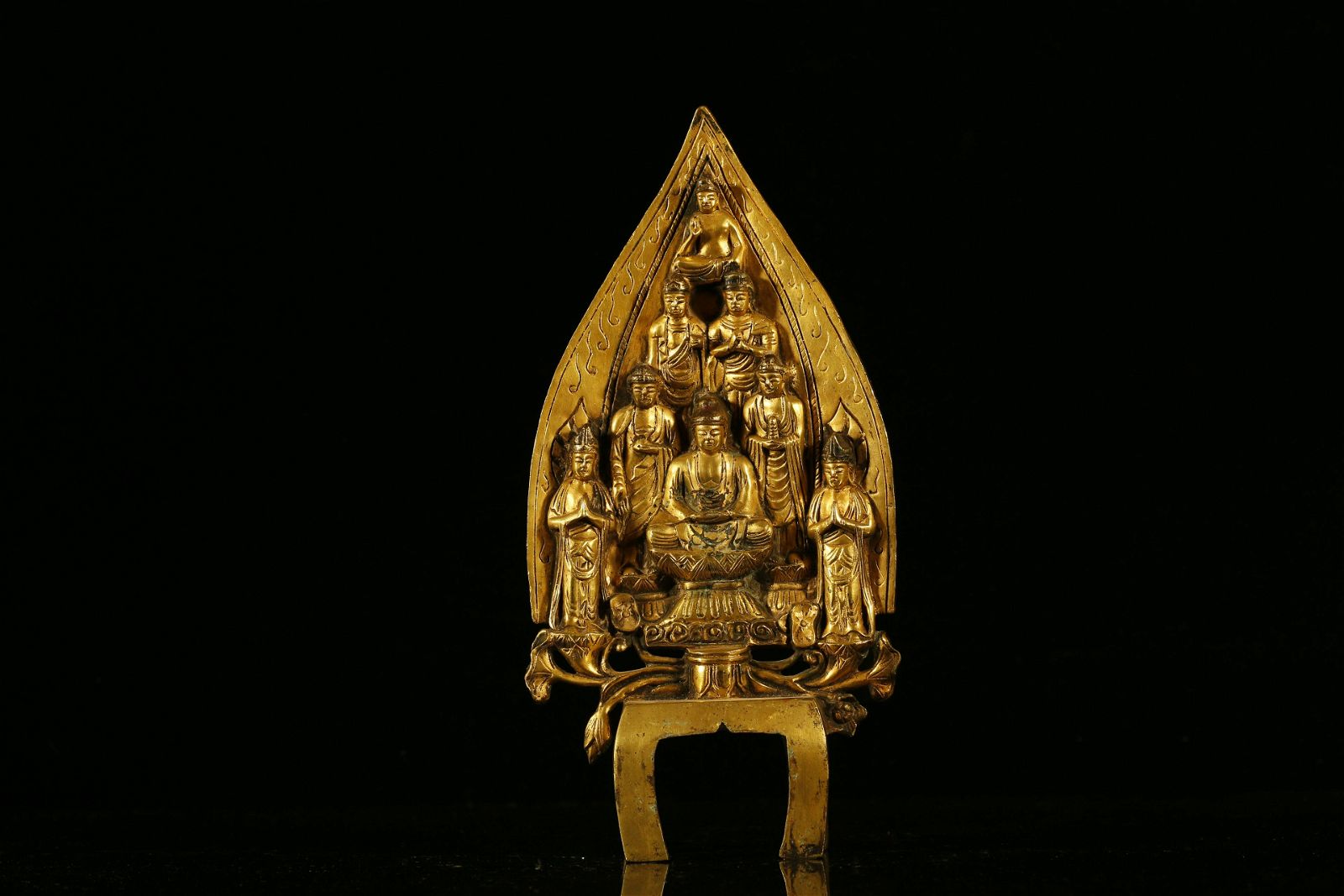 A RARE GILT-BRONZE FIGURE OF