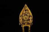 A RARE GILT-BRONZE FIGURE OF S