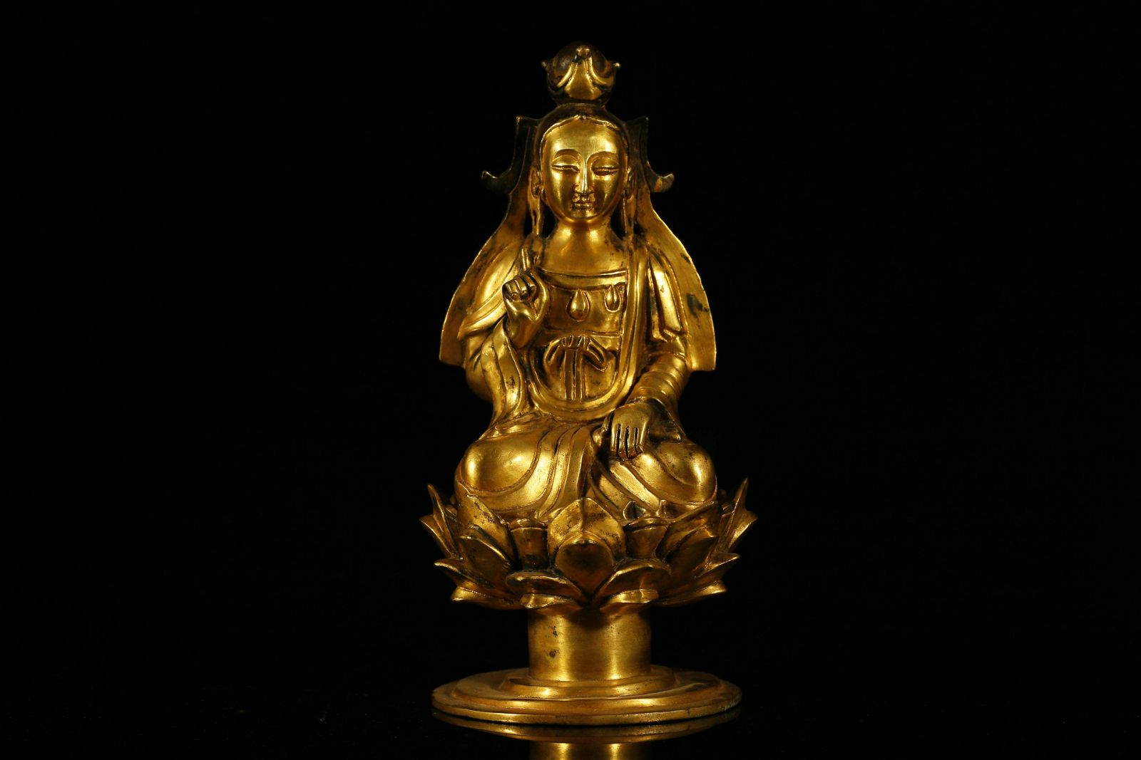 A RARE GILT-BRONZE FIGURE OF