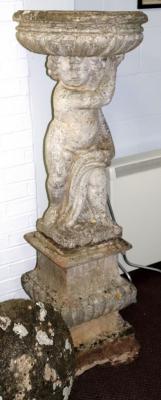 A reconstituted garden vase with