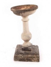 A reconstituted stone bird bat