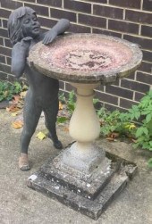 A reconstituted stone bird bat