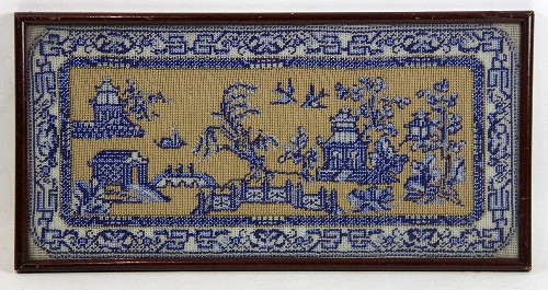 A rectangular needlework and gilt