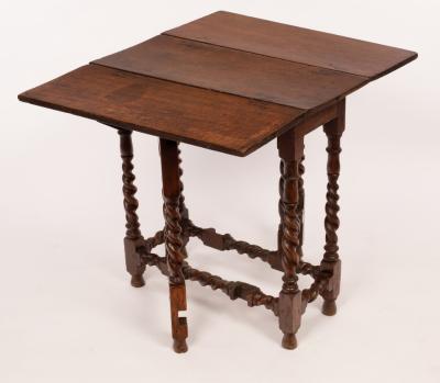 A rectangular oak gateleg table