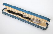 A rectangular silvered dial wi