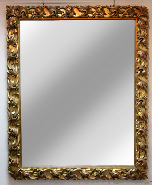 A rectangular wall mirror in a
