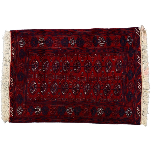A Red Afghan Bokhara rug, 115cm x