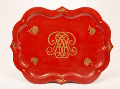 A red and gold lacquer tray with