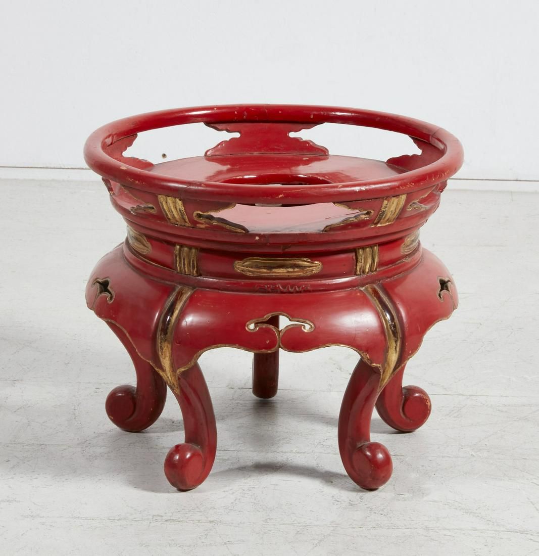 A RED GILT AND LACQUER STAND,