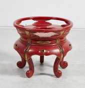 A RED GILT AND LACQUER STAND,