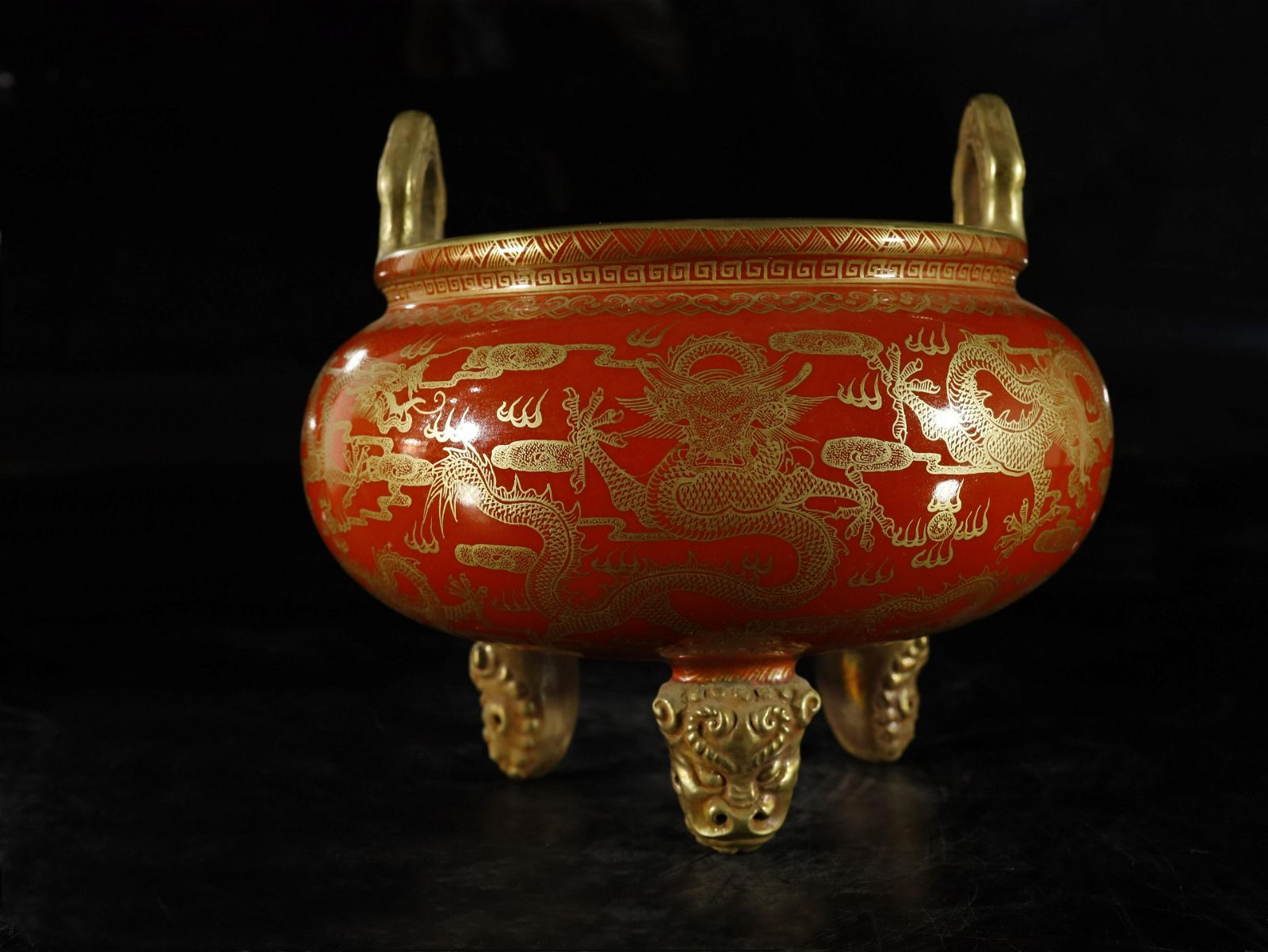 A RED-GLAZED PAINTED GOLD