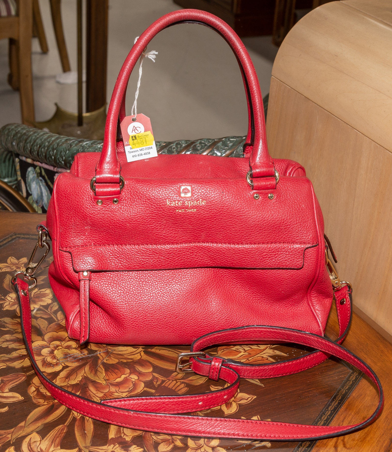 A RED KATE SPADE BAG A red