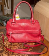 A RED KATE SPADE BAG A red lea