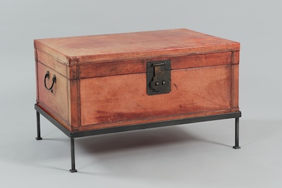 A Red Leather Trunk on a Steel