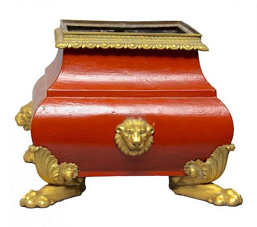 A RED TOLE PEINTE PLANTER WITH