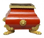 A RED TOLE PEINTE PLANTER WITH