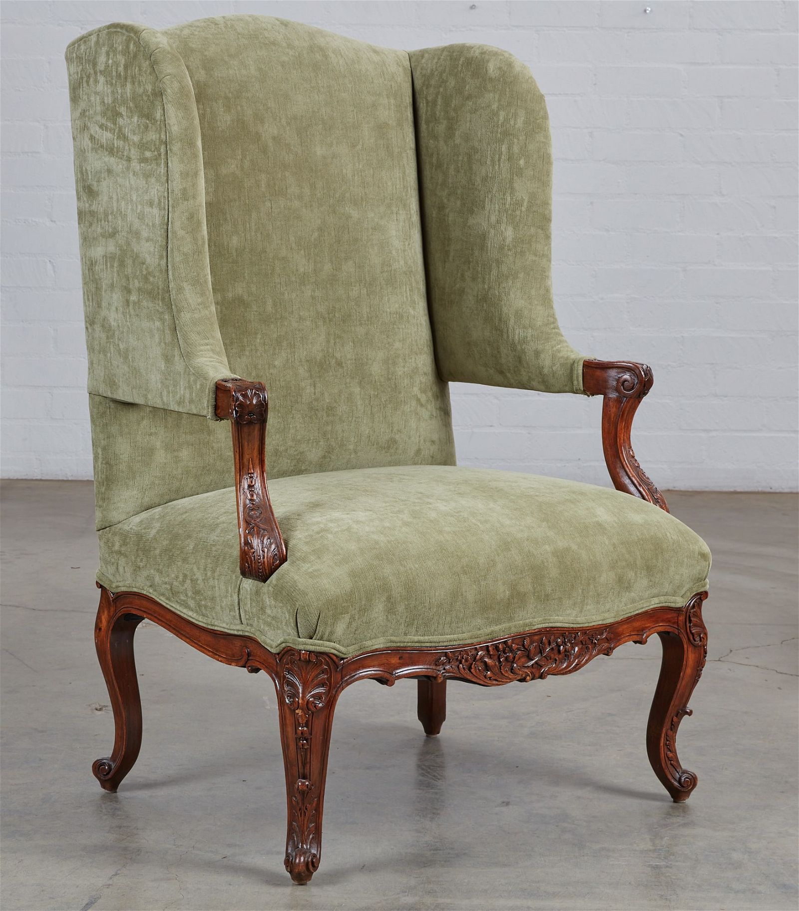 A REGENCE STYLE WALNUT FAUTEUIL A L