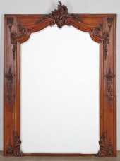 A REGENCE STYLE WALNUT MIRROR,