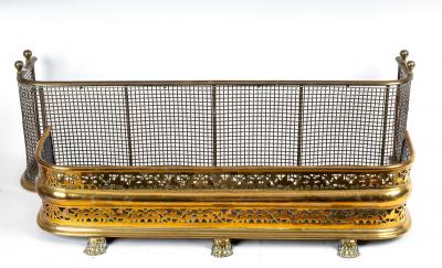 A Regency brass D-shaped fender,