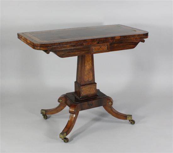 A Regency brass inlaid rosewood and