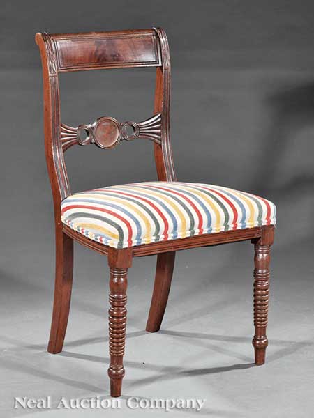 A Regency Carved Mahogany Side